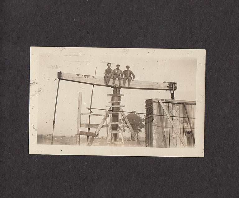 Item #008967 Photograph album documenting two itinerant roughnecks’ travel through New York, Pennsylvania, and Ohio until they found jobs at the Woodville Oil Field. Unidentified compiler.